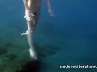 Pleasant Nastya swimming nude in the sea